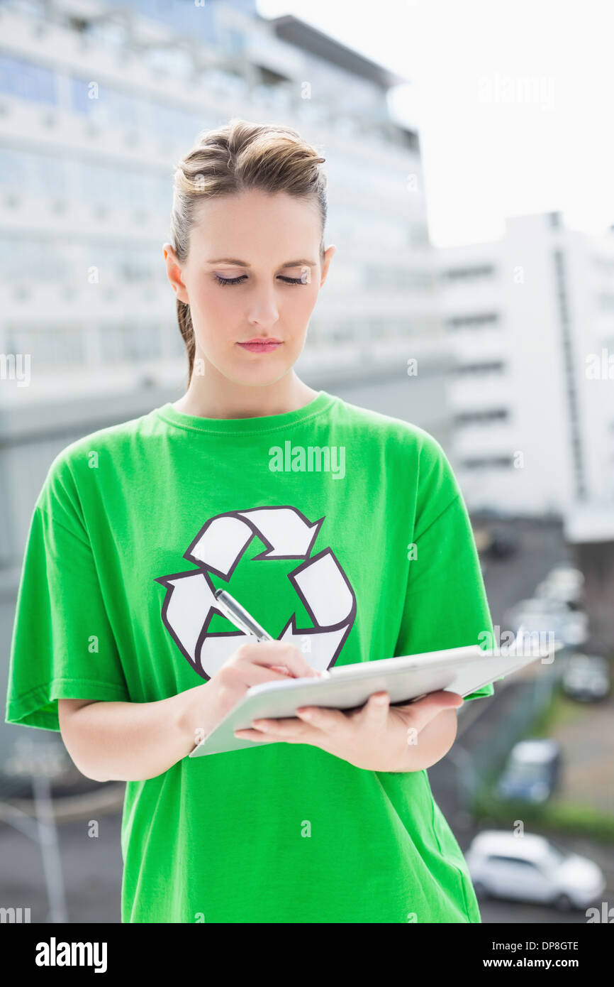 Concentrated environmental activist writing Stock Photo
