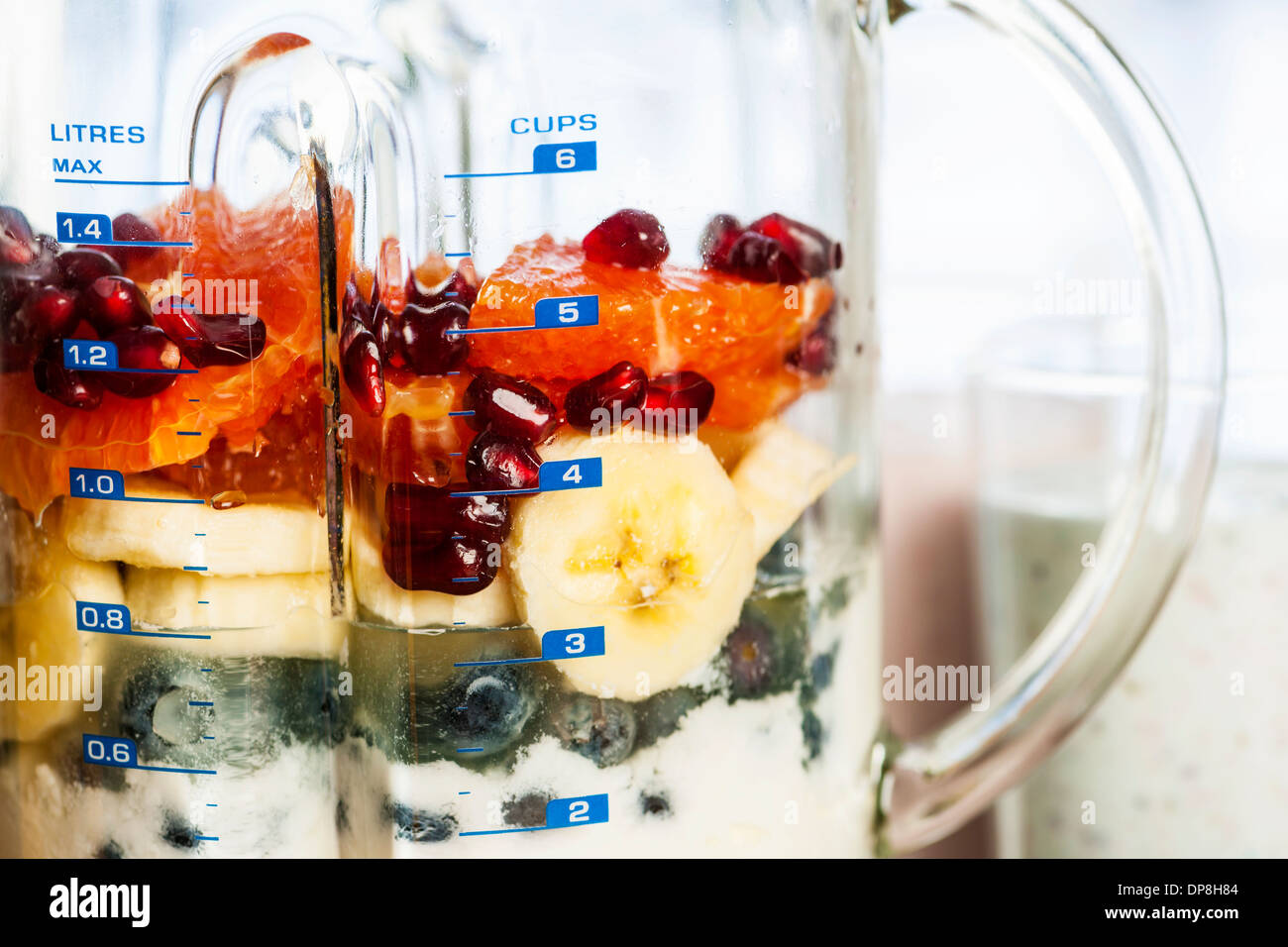 Closeup of healthy smoothie ingredients in blender with fresh fruit Stock Photo
