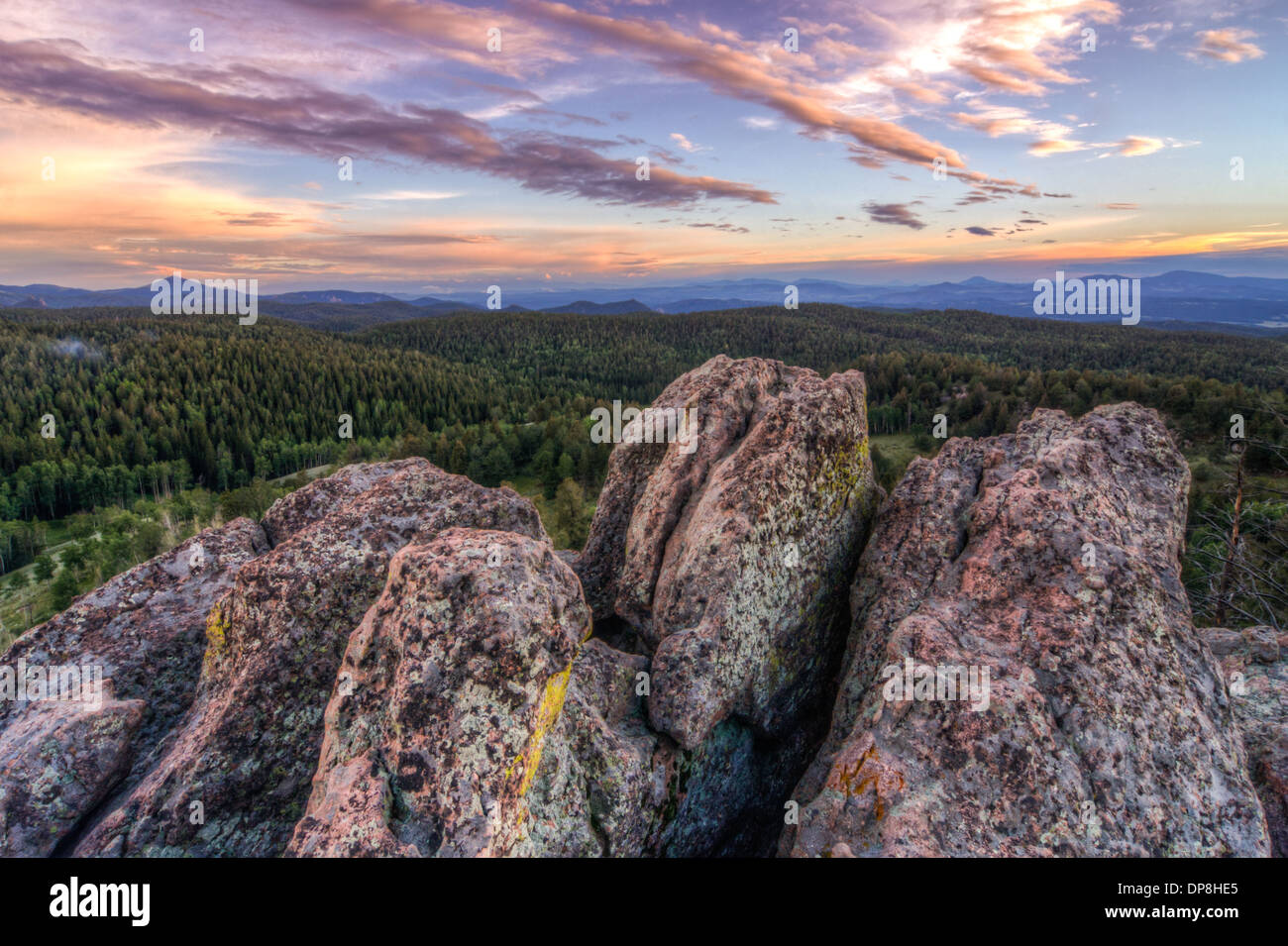 Beautiful purple clouds over granite rocks and mountain forests in the Rockies of Colorado Stock Photo