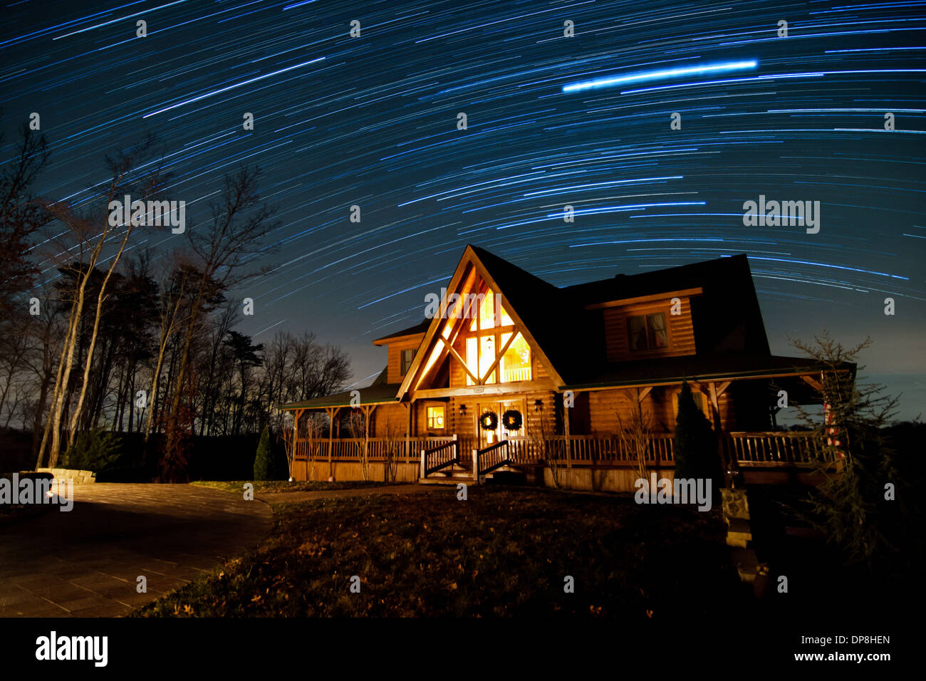 Star Trails Arc Over Warm And Cozy Look Out Lodge Cabin On Lake