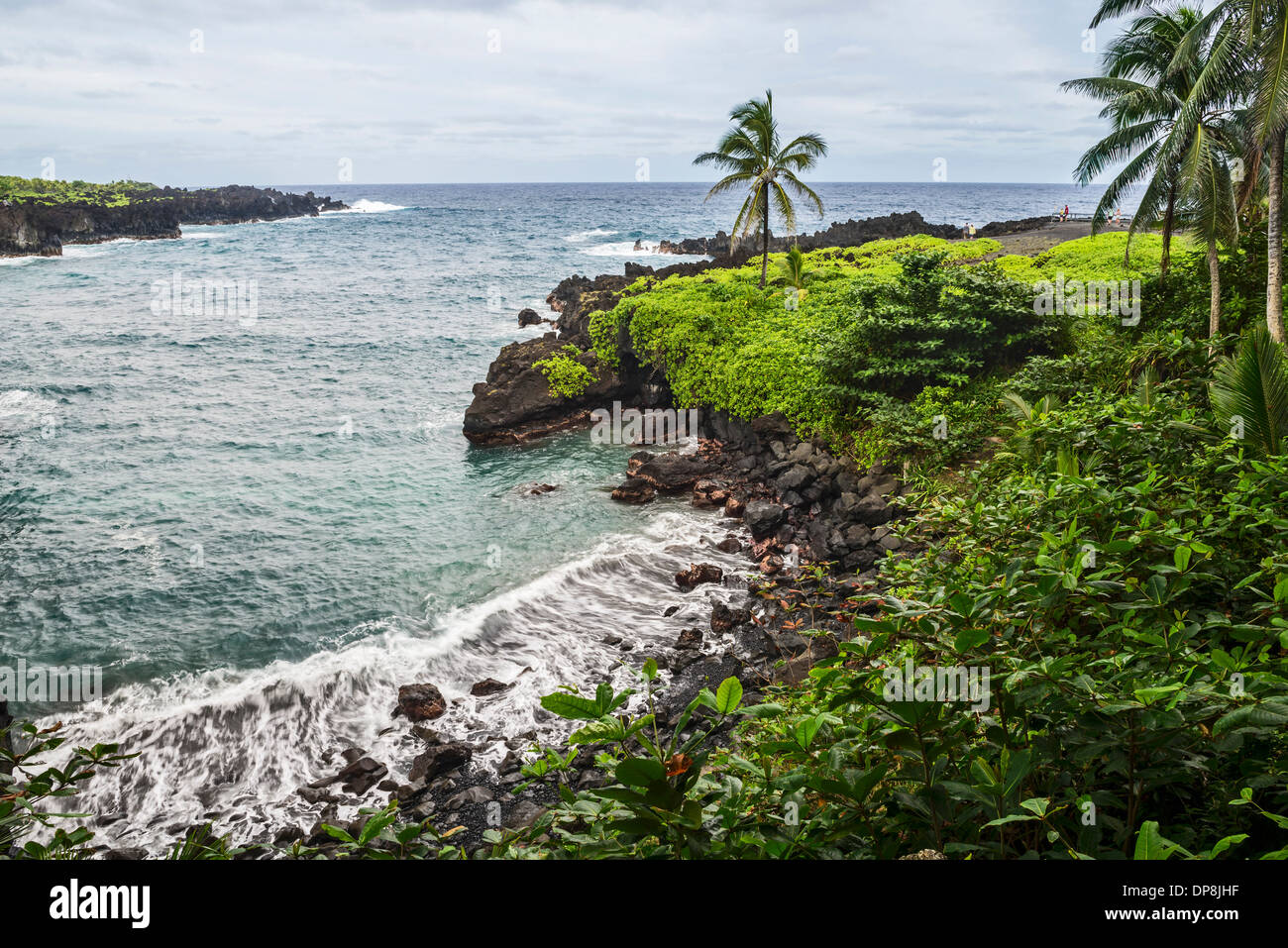 The exotic and famous Black Sand Beach of Waianapanapa State Park in Maui, Hawaii. Stock Photo