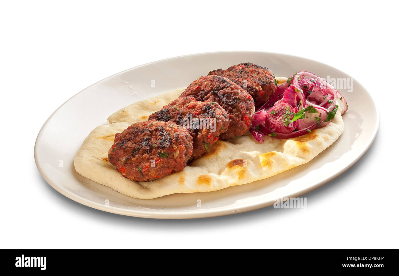 Meatballs on grilled tortilla with red onions isolated on white background Stock Photo