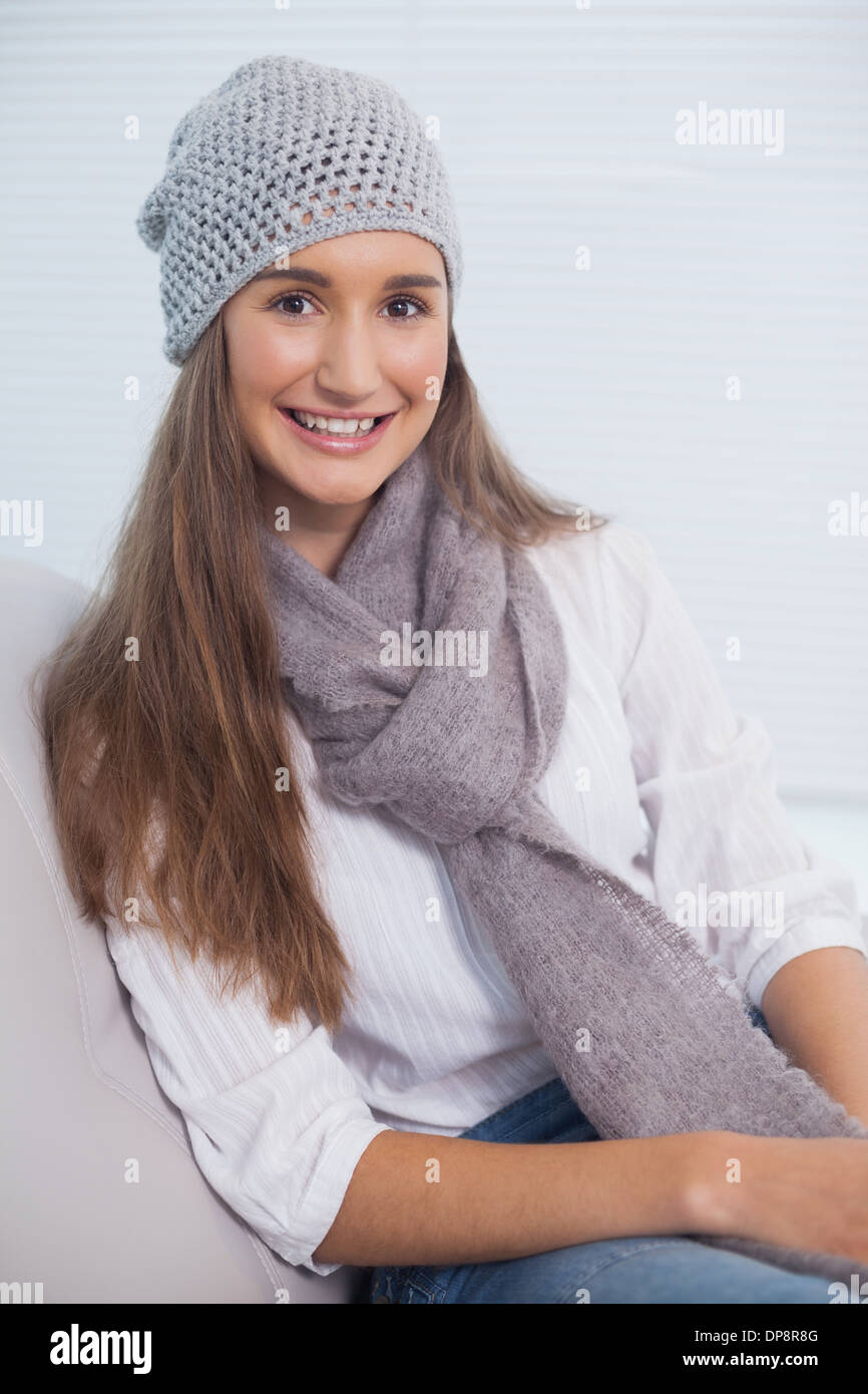 Cheerful attractive brunette with winter hat on posing Stock Photo