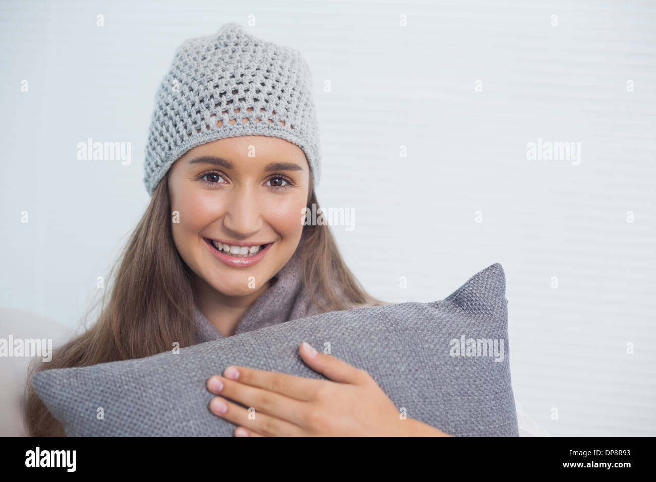 Happy pretty brunette with winter hat on posing Stock Photo