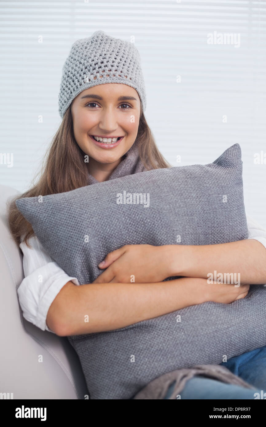 Smiling pretty brunette with winter hat on posing Stock Photo