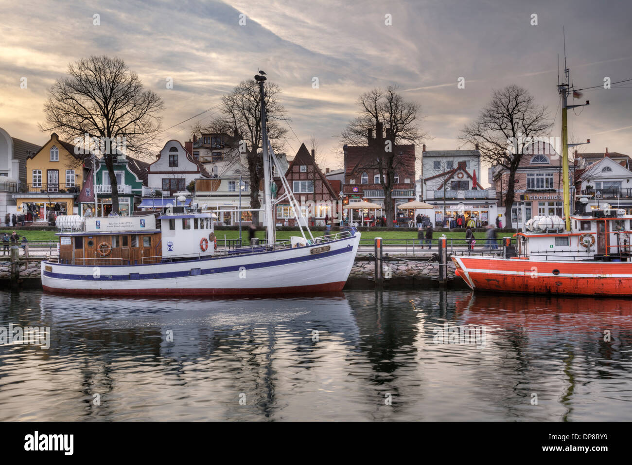 Old buildings and boats on the Alter Strom, Warnemuende, Mecklenburg Vorpommern, Germany Stock Photo