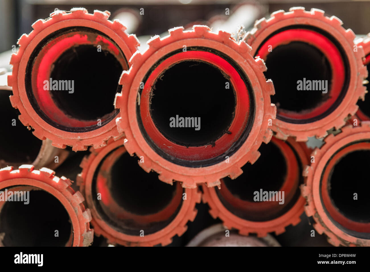 Close view of stacked irrigation pipes in the field Stock Photo Alamy