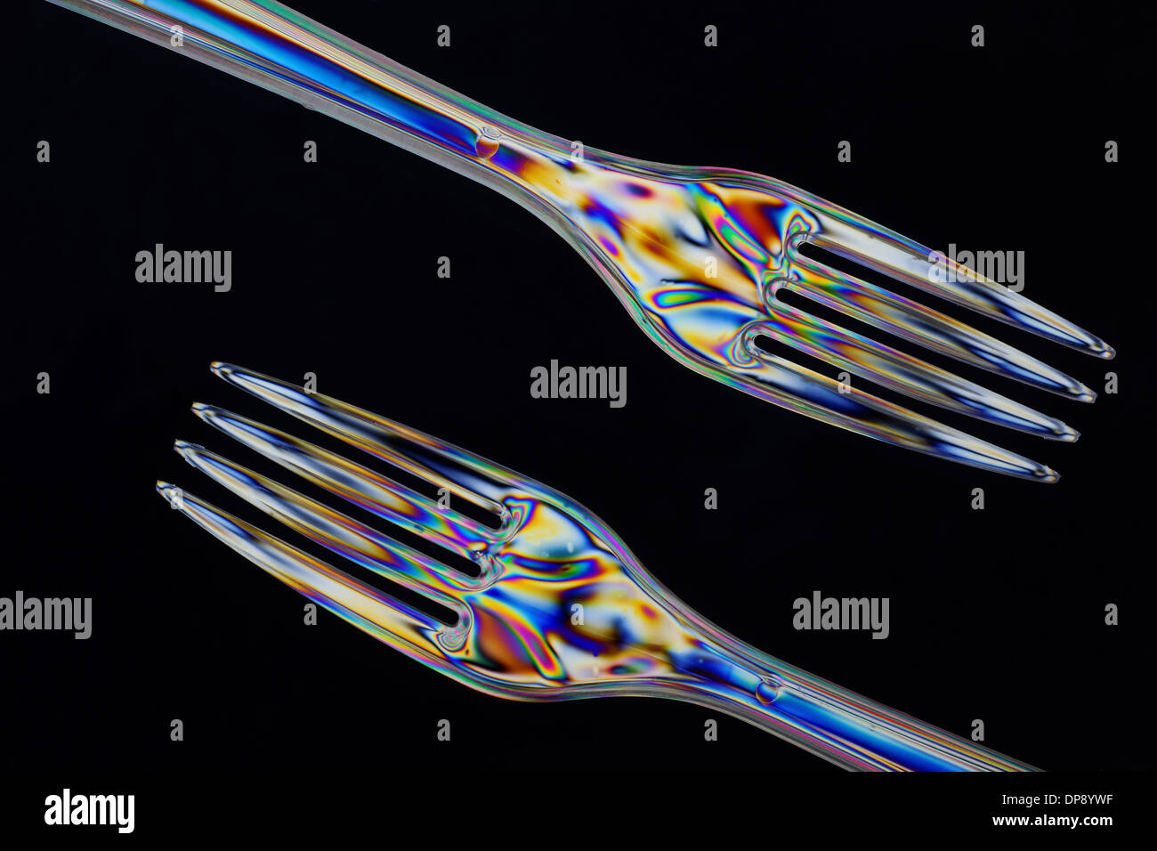 Plastic forks taken with double polarised light in closeup Stock Photo