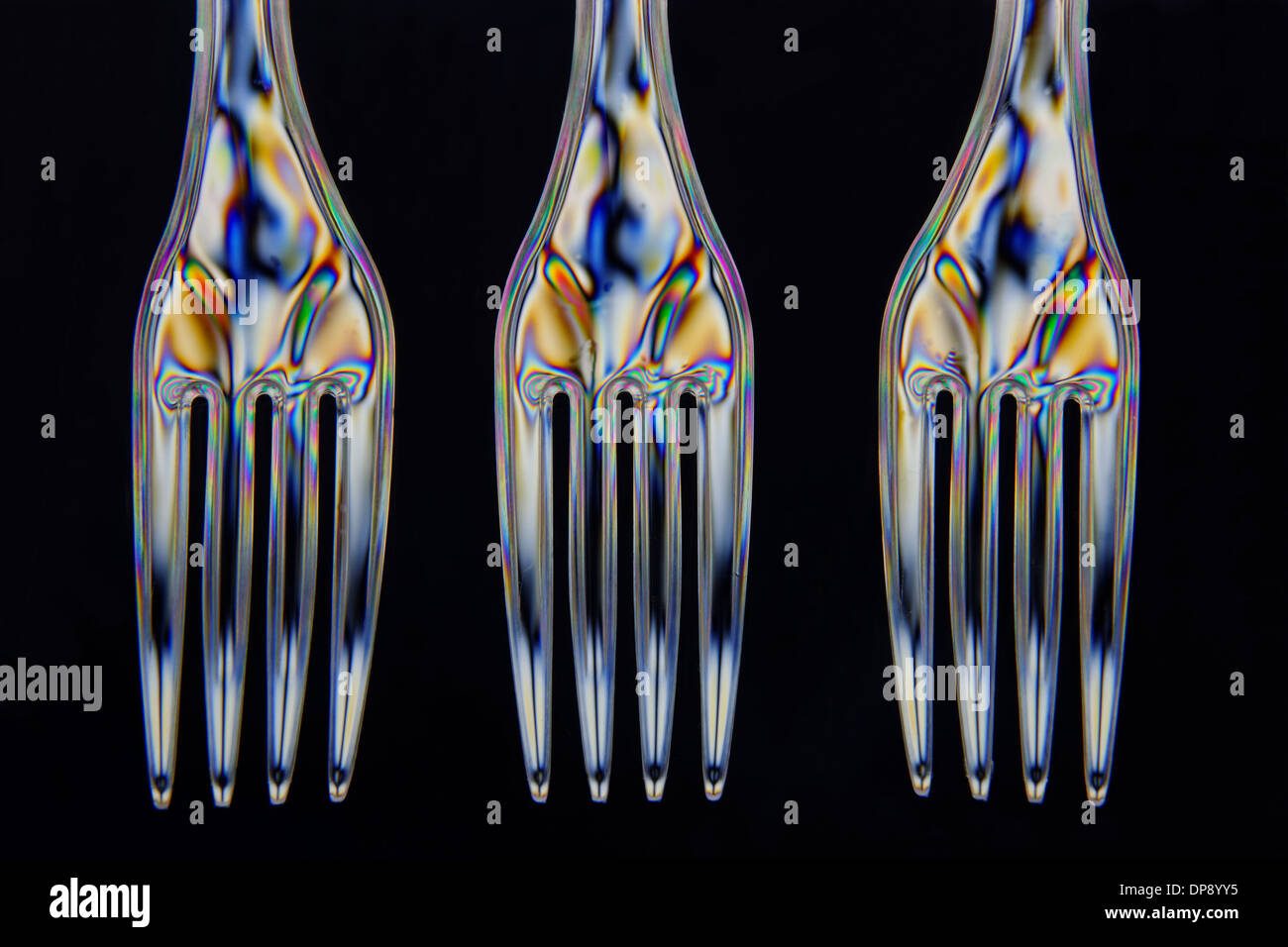 Plastic forks taken with double polarrised light in closeup Stock Photo