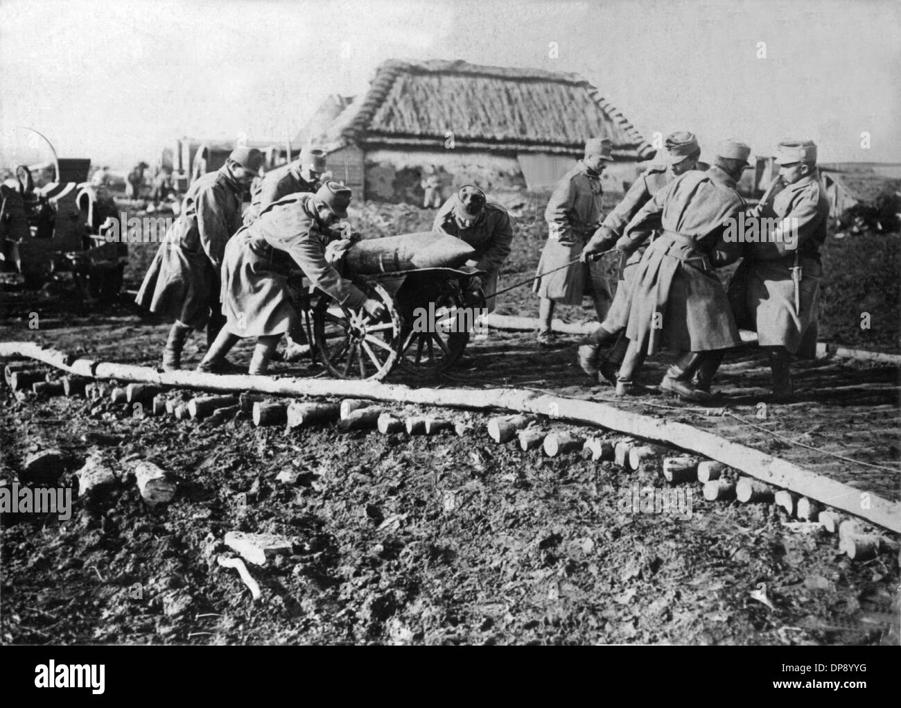 A bullet of 30, 5 centimetres is transported to a gun emplacement in Galicia by soldiers of the Austrian-Hungarian army. The deadly shots by Serbian nationalists on the Austrian heir to the throne Franz Ferdinand on the 28th of June in 1914 in Sarajevo caused the outbreak of the Great War, later to be called World War I, in August 1914. The Central Powers, namely Germany, Austria-Hungary and as well later the Ottoman Empire (Turkey) and Bulgaria against the Triple Entente, consisting of Great Britain, France and Russia, as well as numerous allies. The sad result of World War I, which ended wi Stock Photo