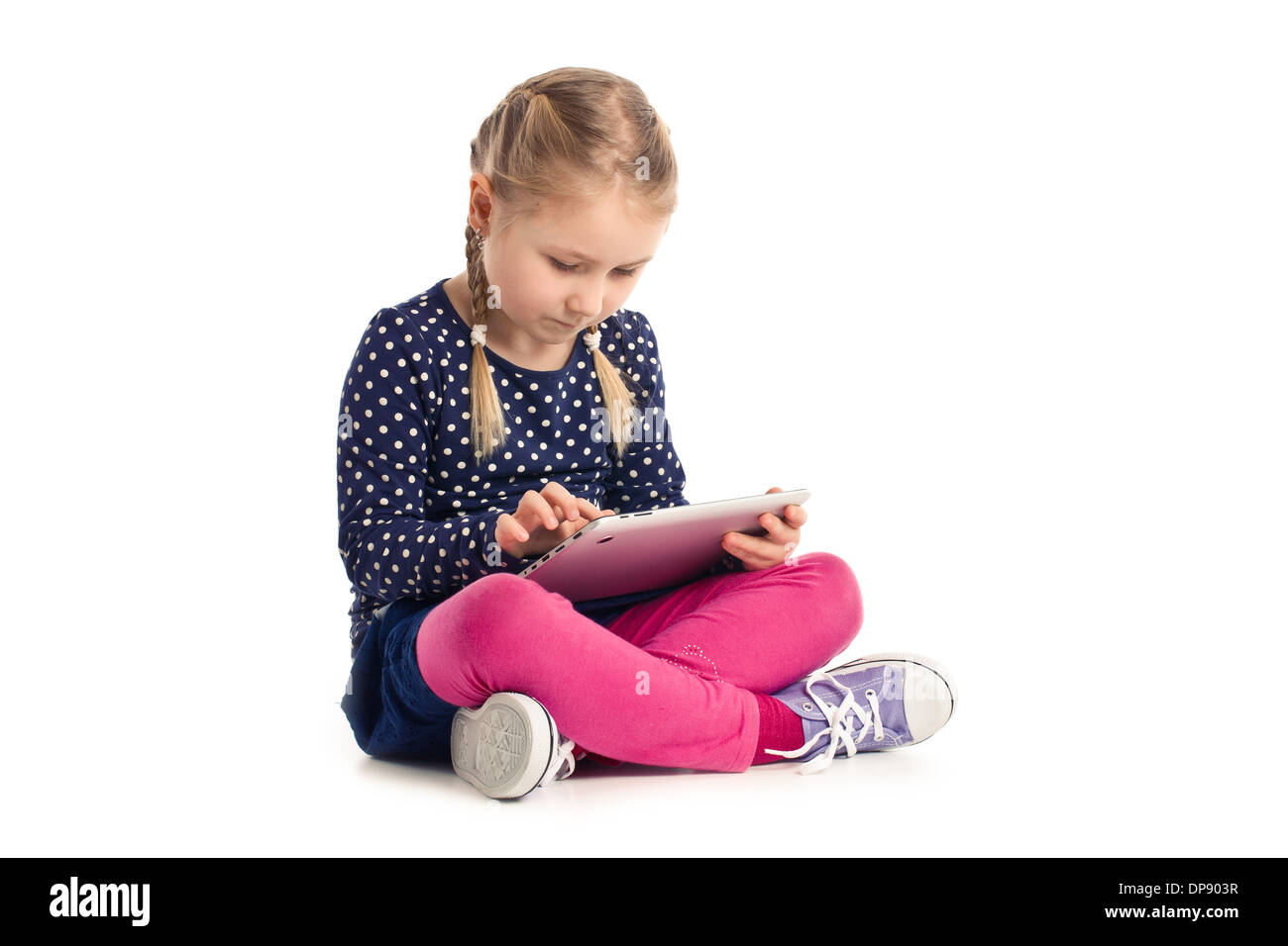 little sitting girl with tablet on white background Stock Photo - Alamy