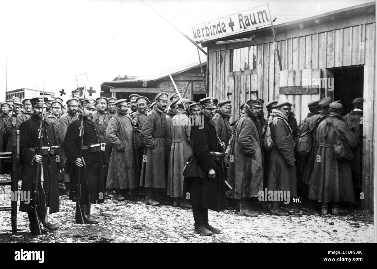 The first Russian prisoners of war stand in a queue in front of the ...