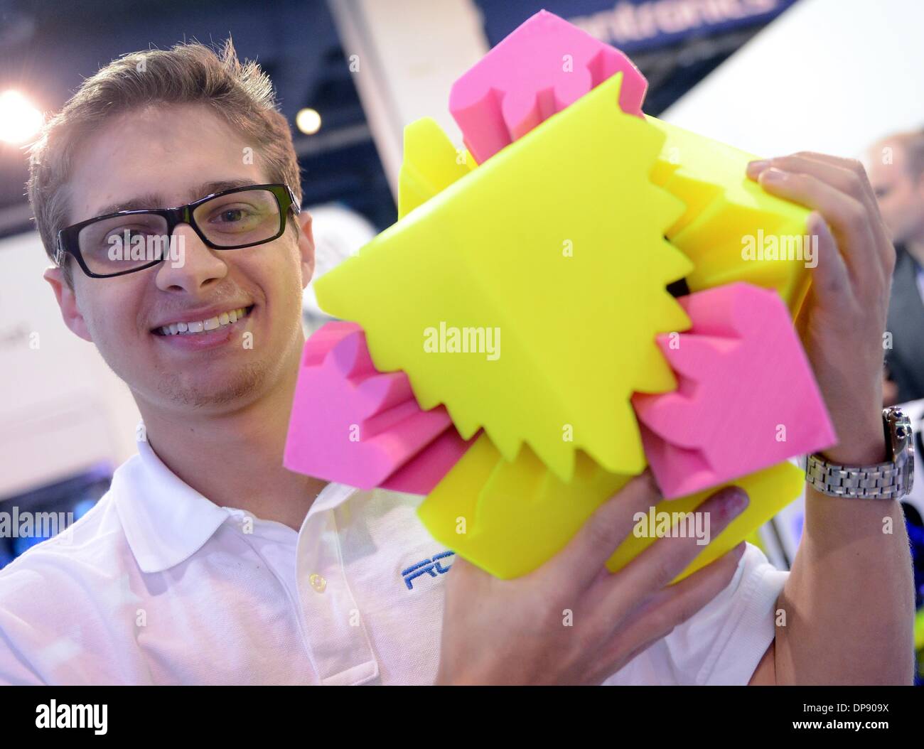 Las Vegas, USA. 07th Jan, 2014. Coby Kabili, founder of company Robo3D, holds up a 3D print at the Consumer Electronics Show (CES) in Las Vegas, USA, 07 January 2014. The show runs from 07 until 10 January 2014. Photo: BRITTA PEDERSEN/dpa/Alamy Live News Stock Photo