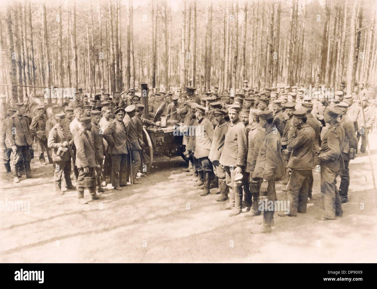 German soldiers queue for a dish from the field kitchen, nicknamed
