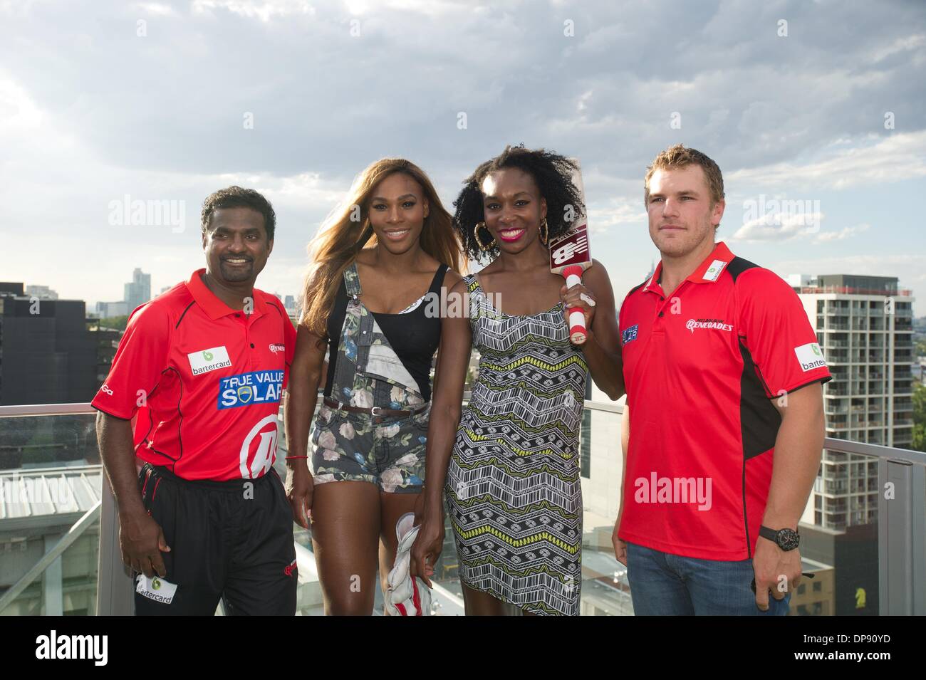 Melbourne, Australia. 9th Jan, 2014. Venus Williams (2nd, R) and Serena Williams (2nd, L) of the United States pose for photos with Melbourne Renegades players Muthiah Muralidaran (1st, L) and Aaron Finch during a media event ahead of 2014 Australian Open in Melbourne, Australia, Jan. 9, 2014. Credit:  Bai Xue/Xinhua/Alamy Live News Stock Photo