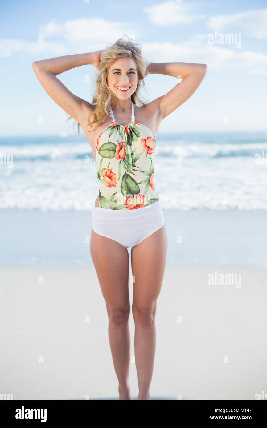 Pleased blonde model in swimsuit posing looking at camera Stock Photo