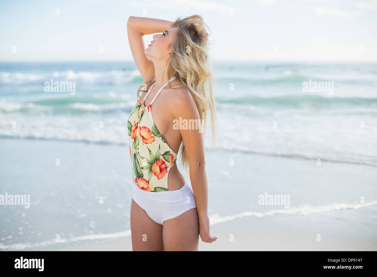 Thinking blonde model in swimsuit posing looking away Stock Photo
