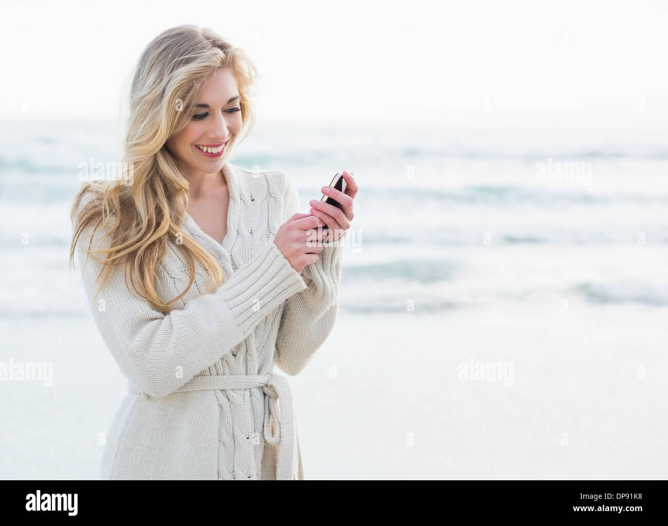 Pleased blonde woman using hi-res stock photography and images - Alamy