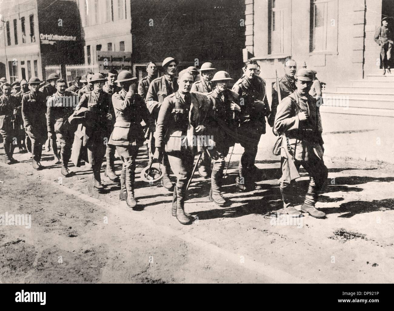A German soldier leads a group of British officers that are prisoners ...