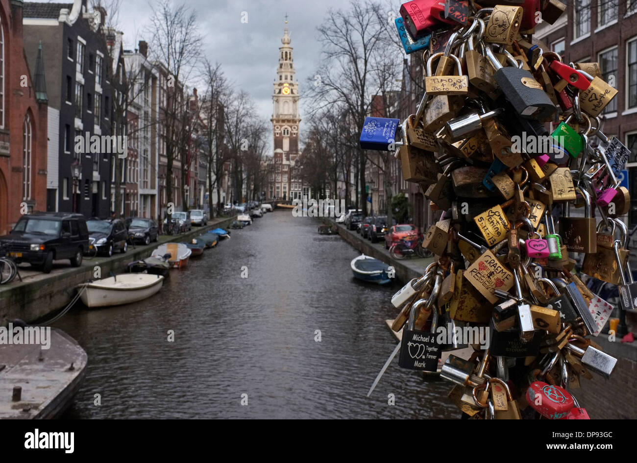 love locks, love padlock bridge on groenburgwal canal looking towards zuiderkerk, central amsterdam, holland Stock Photo