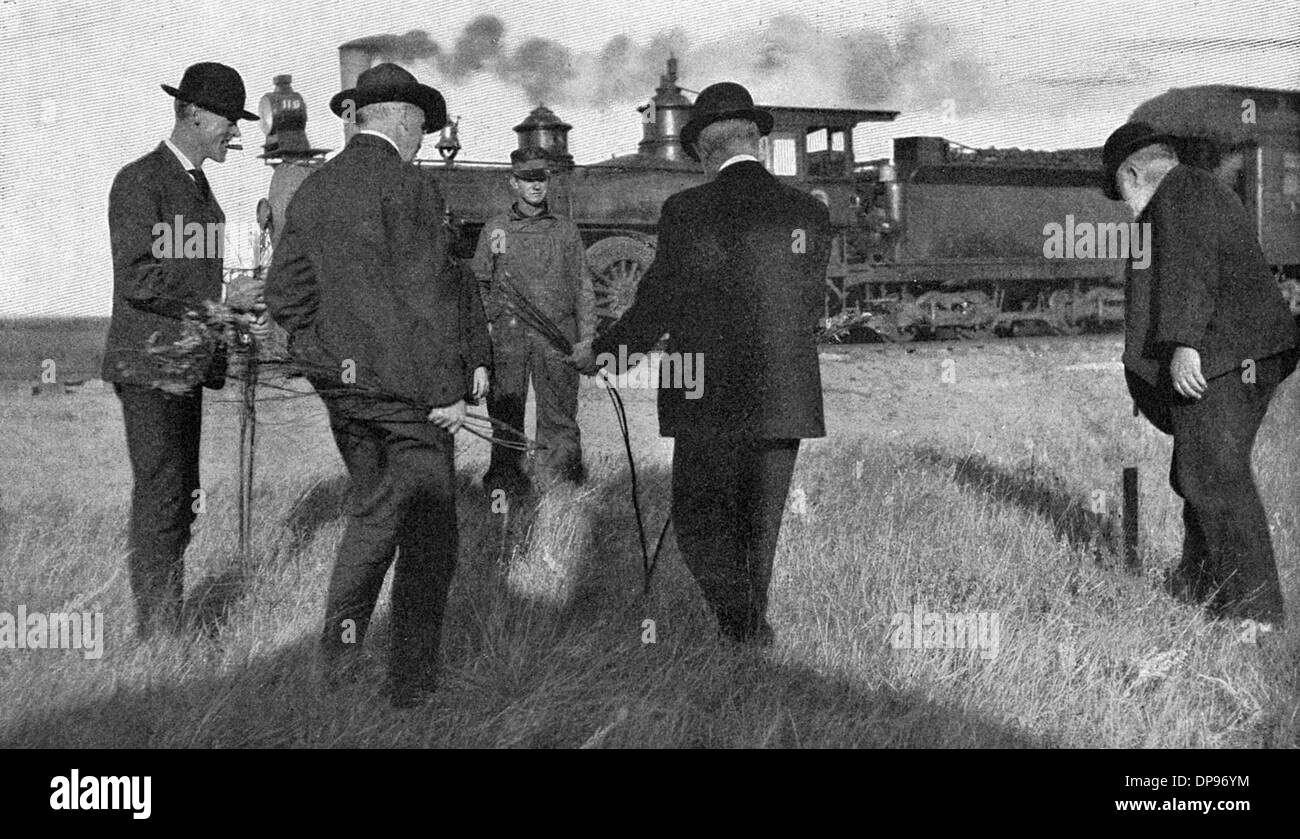 Water dowser and steam train 1907 Stock Photo - Alamy