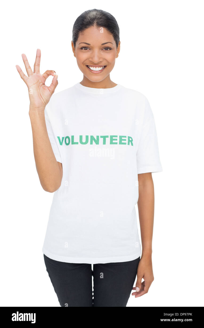 Smiling model wearing volunteer tshirt making okay gesture Stock Photo