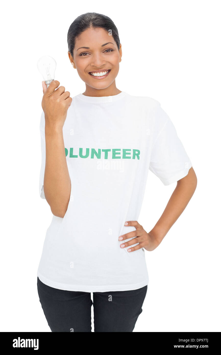 Happy model wearing volunteer tshirt holding light bulb Stock Photo