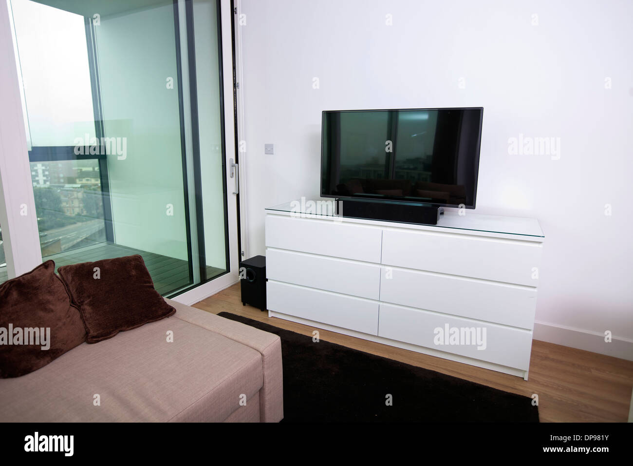 Interior of apartment with flat screen television Stock Photo