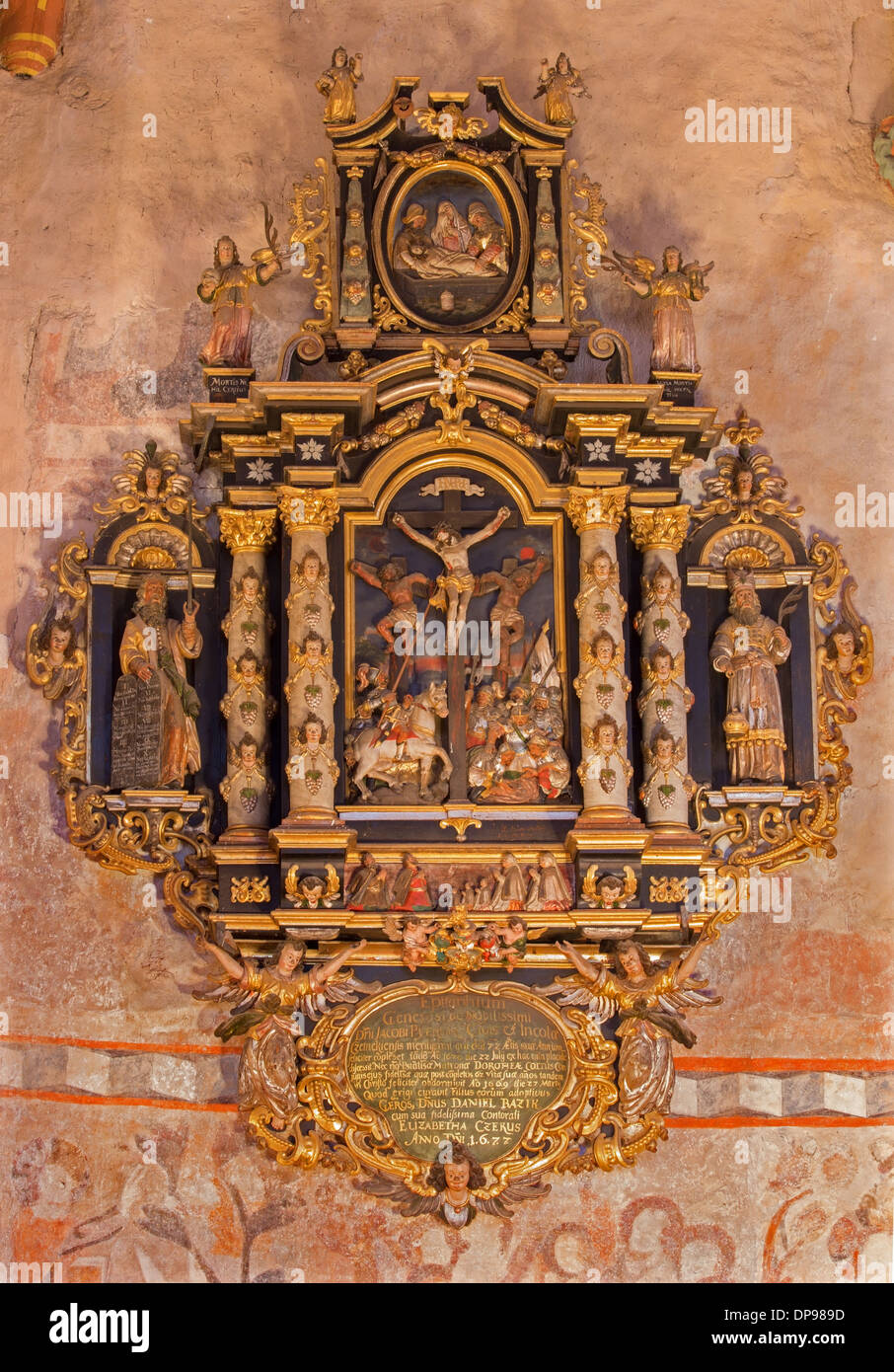 Renaissance-baroque epitaph from presbytery of gothic evangelical church in Stitnik with the crucifixioin motive Stock Photo