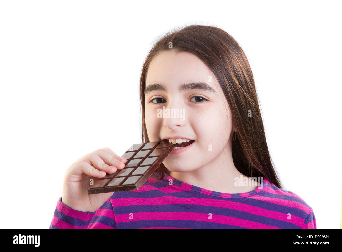 Happy young girl eating chocolate Stock Photo