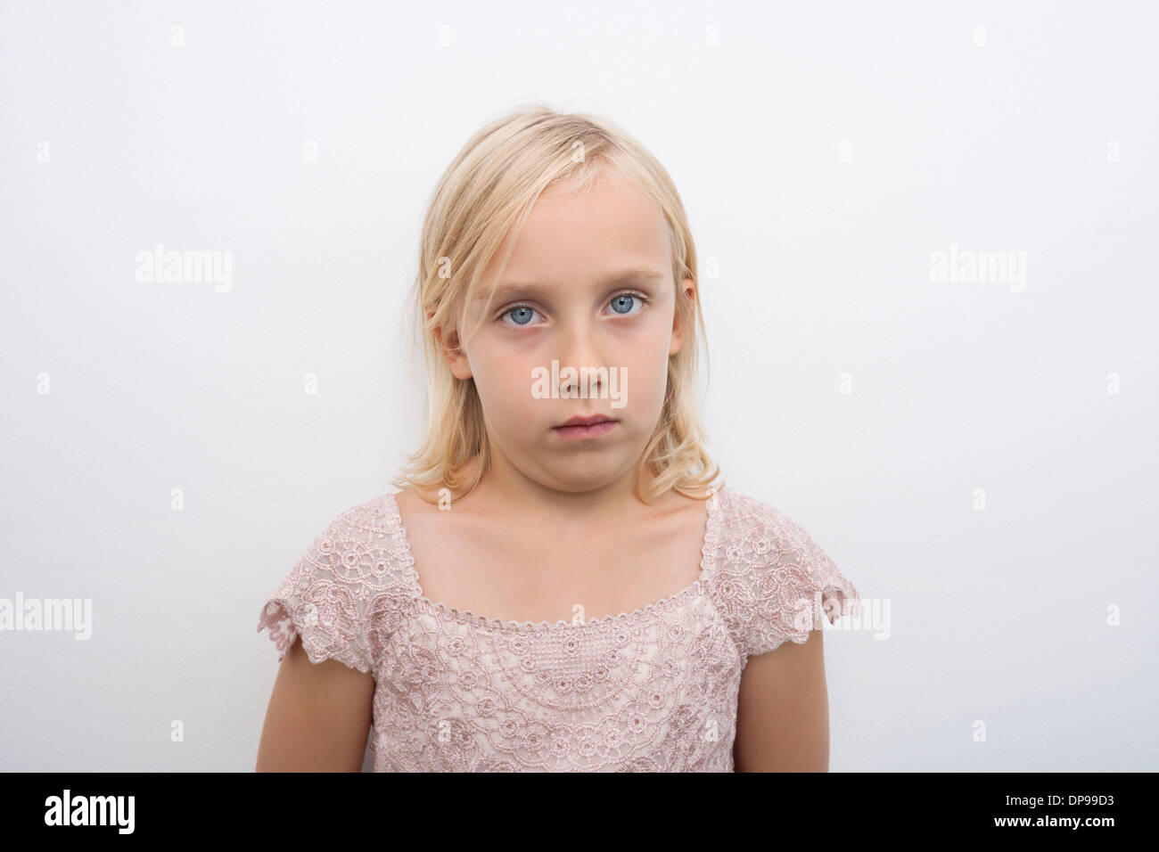 Portrait of girl staring over white background Stock Photo