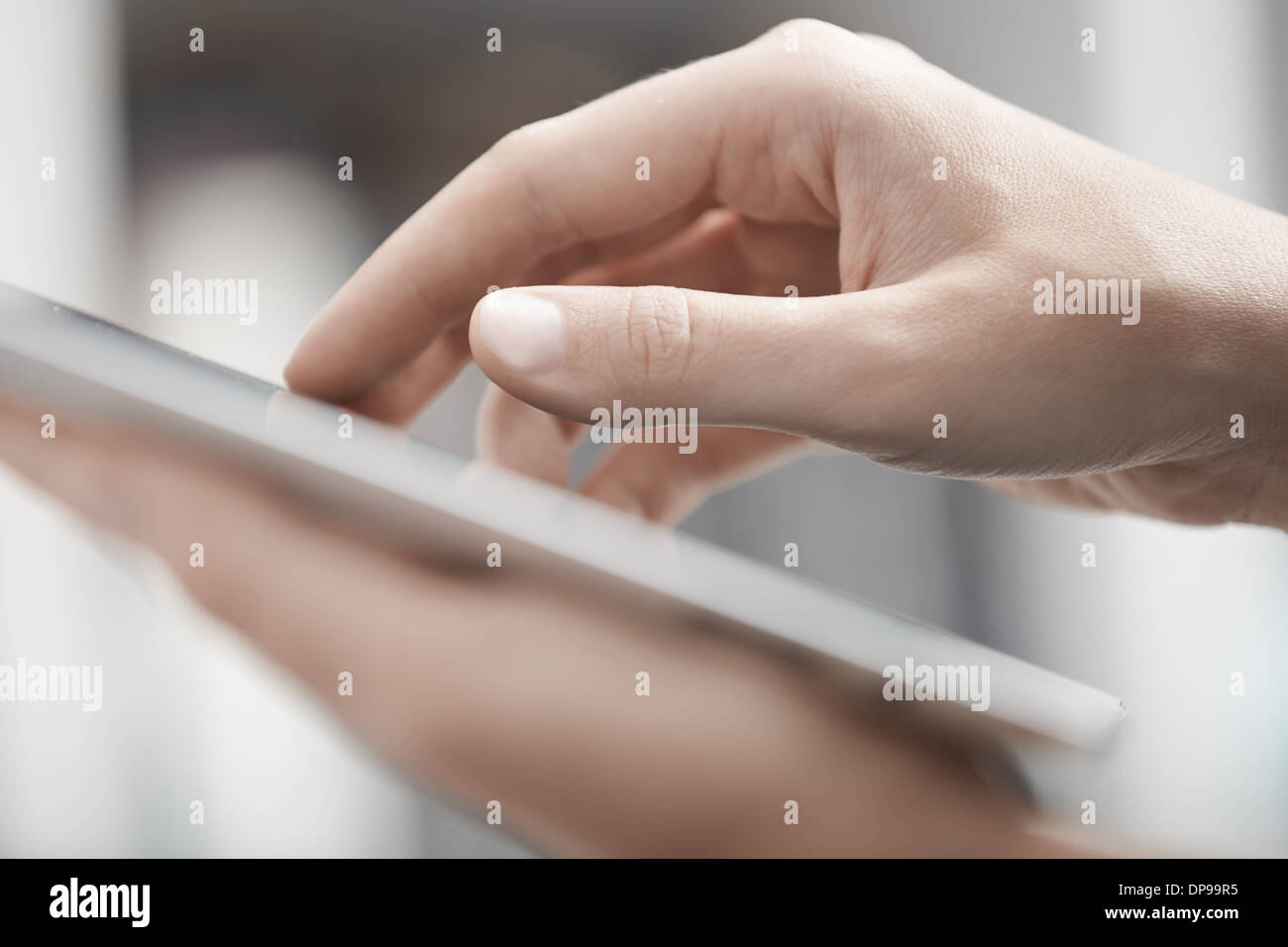 Close-up view on the human hands using digital tablet Stock Photo