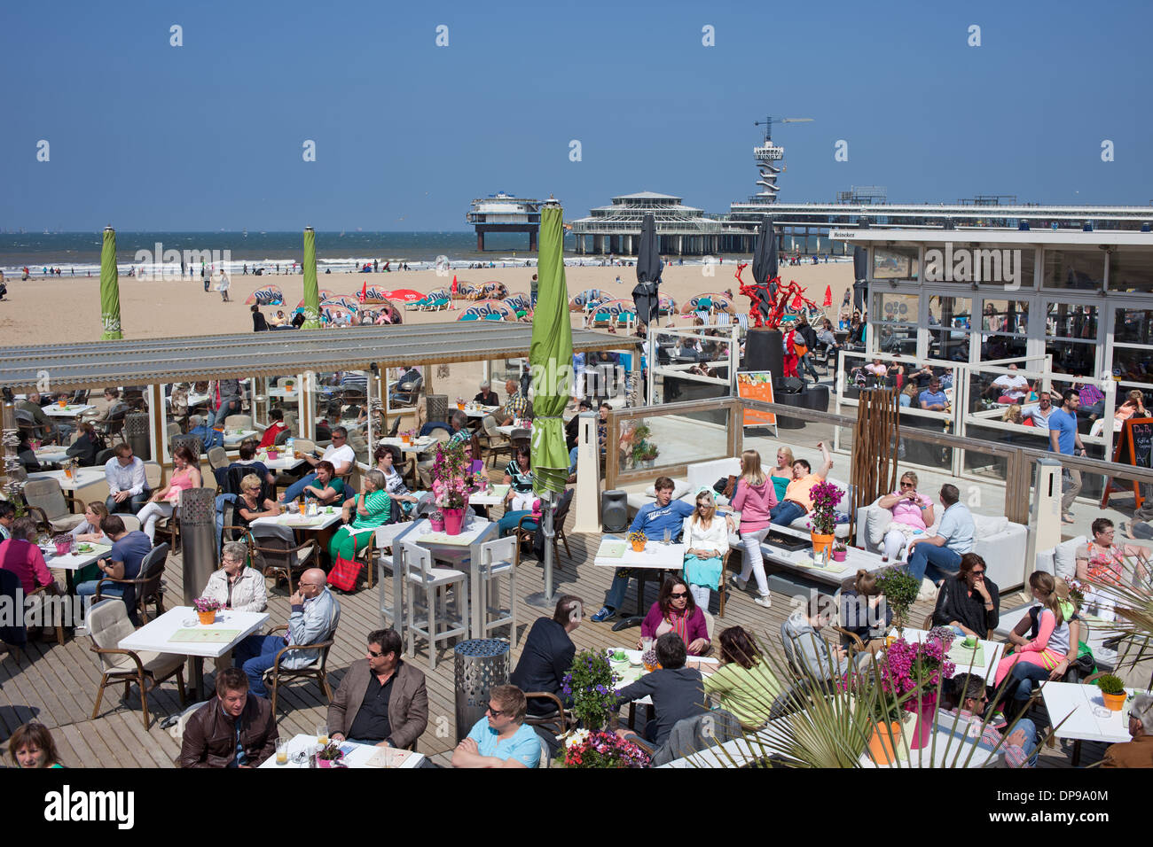 Summertime beach club restaurant in Scheveningen area by the North Sea in the Hague, Holland, Netherlands. Stock Photo