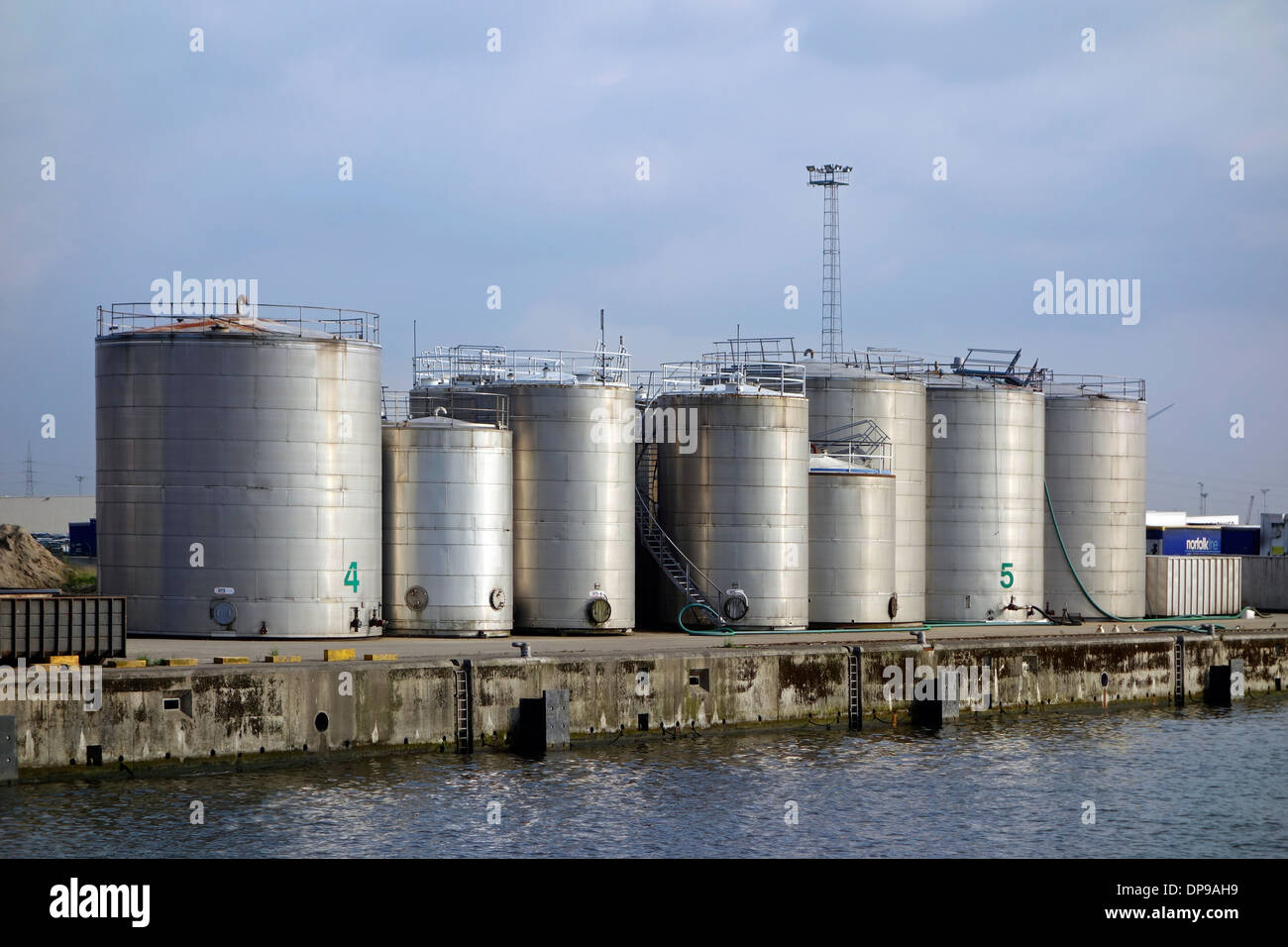 Storage tanks from TWZ, collector of industrial dangerous and non-dangerous waste from shipping traffic, port of Ghent, Belgium Stock Photo
