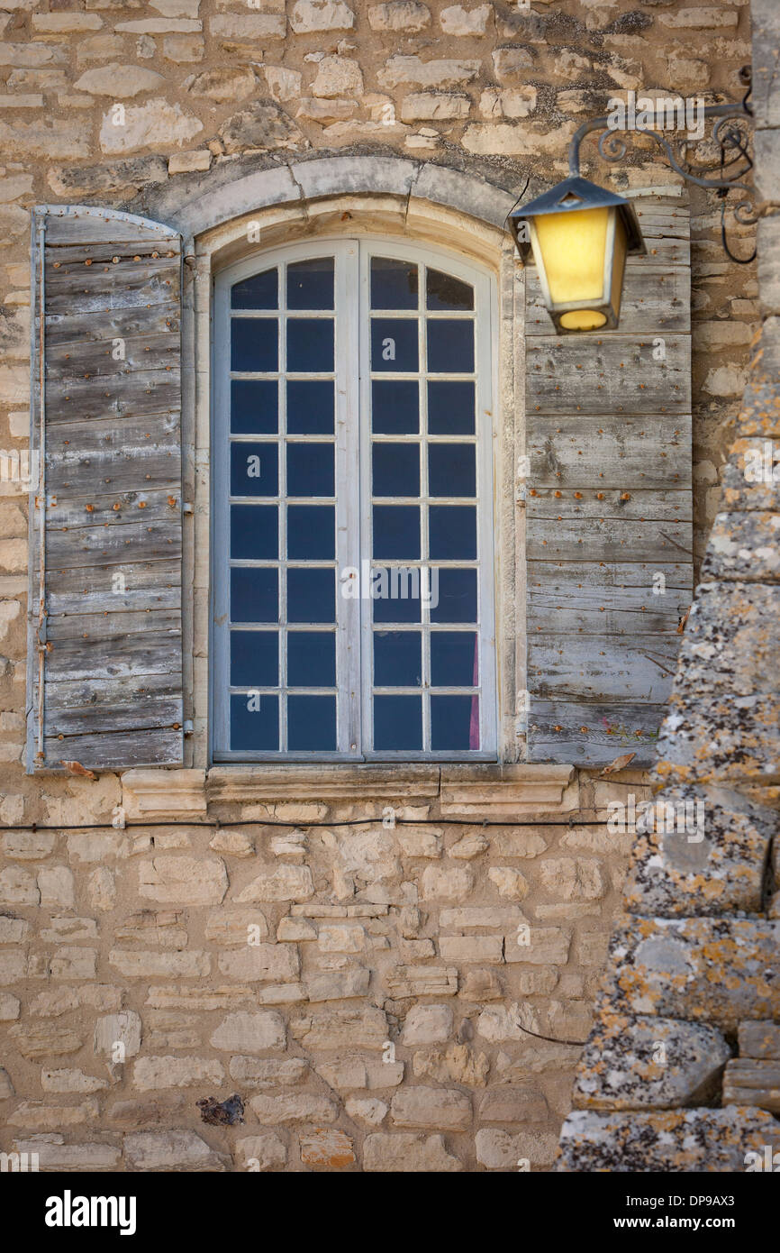 Old church window in town of Murs, Provence, France Stock Photo