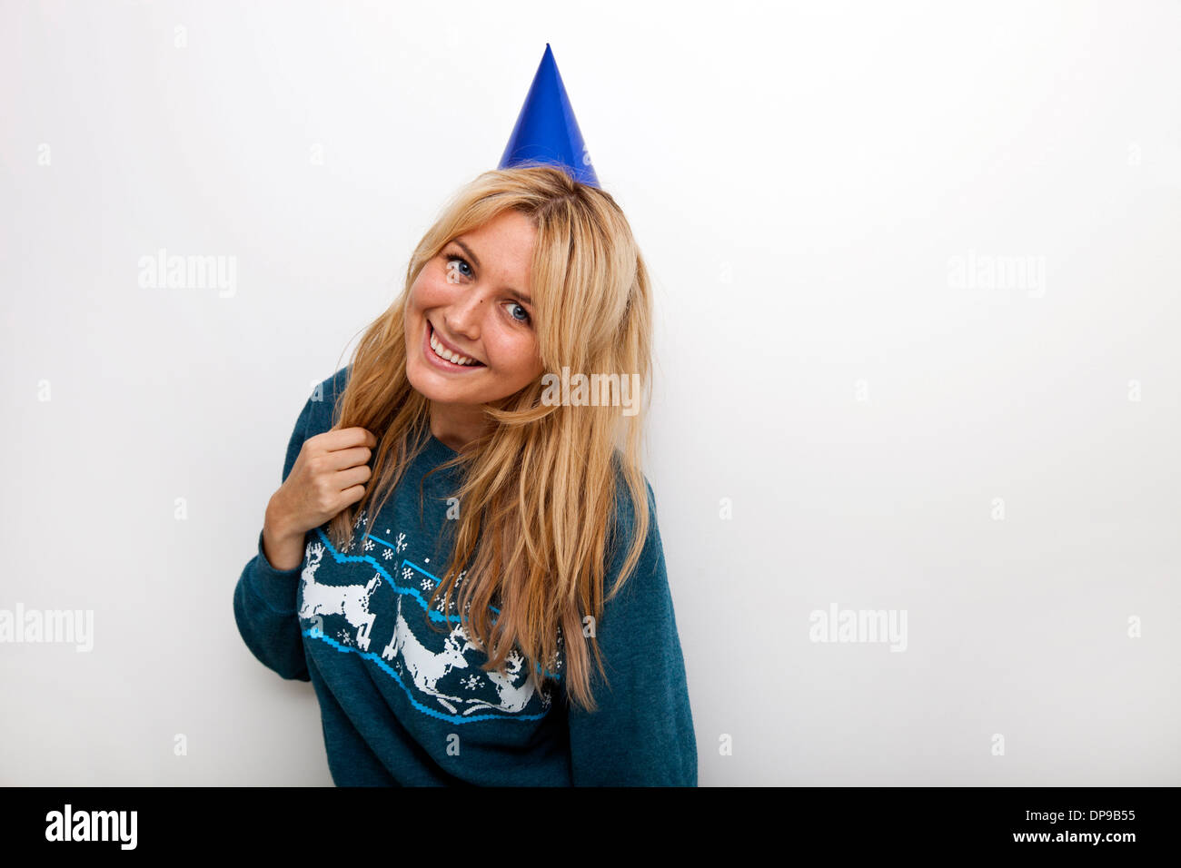 Portrait Of Cheerful Woman Wearing Party Hat Against White Background ...