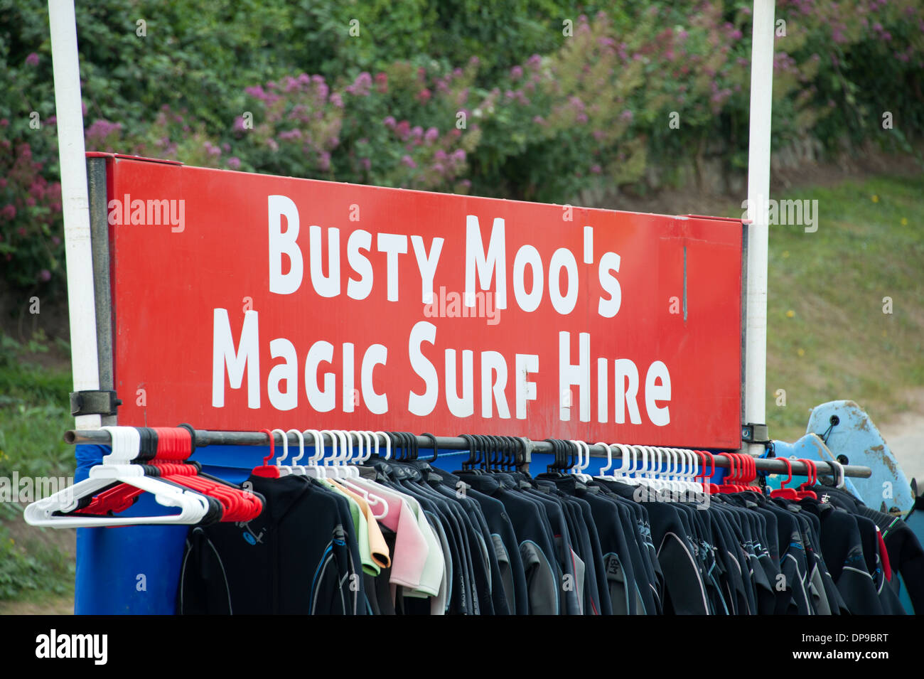 Busty Moo's Moos Magic Surf Hire Funny Sign Stock Photo