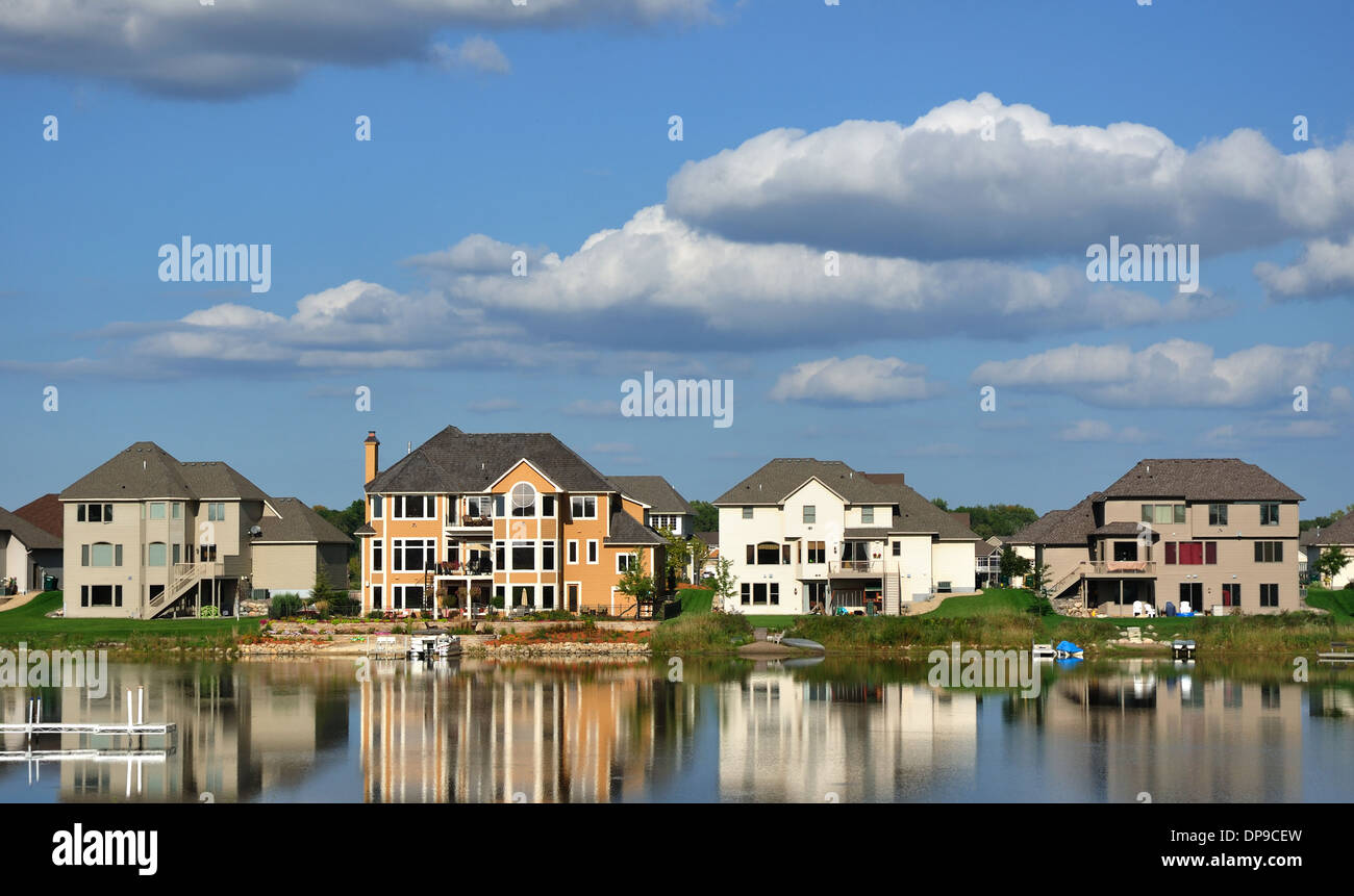 Luxury houses USA - American residential executive lake house homes on a suburban lake complex Stock Photo