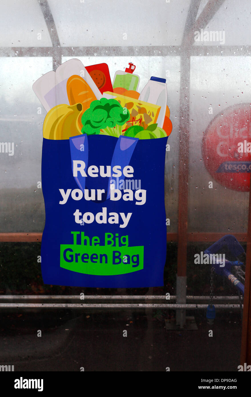 A reuse your bag sign at a Tesco Extra supermarket. Stock Photo