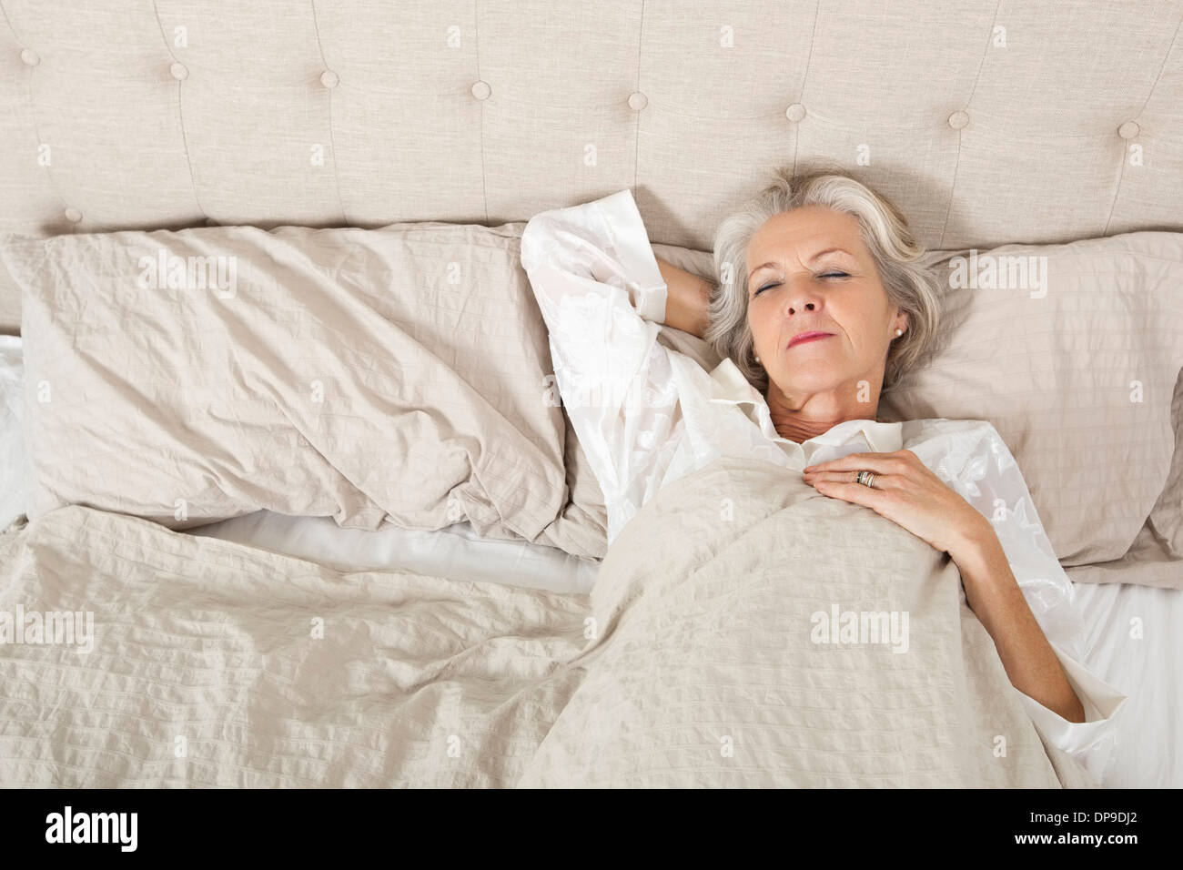 Senior Woman Sleeping In Bed Stock Photo Alamy