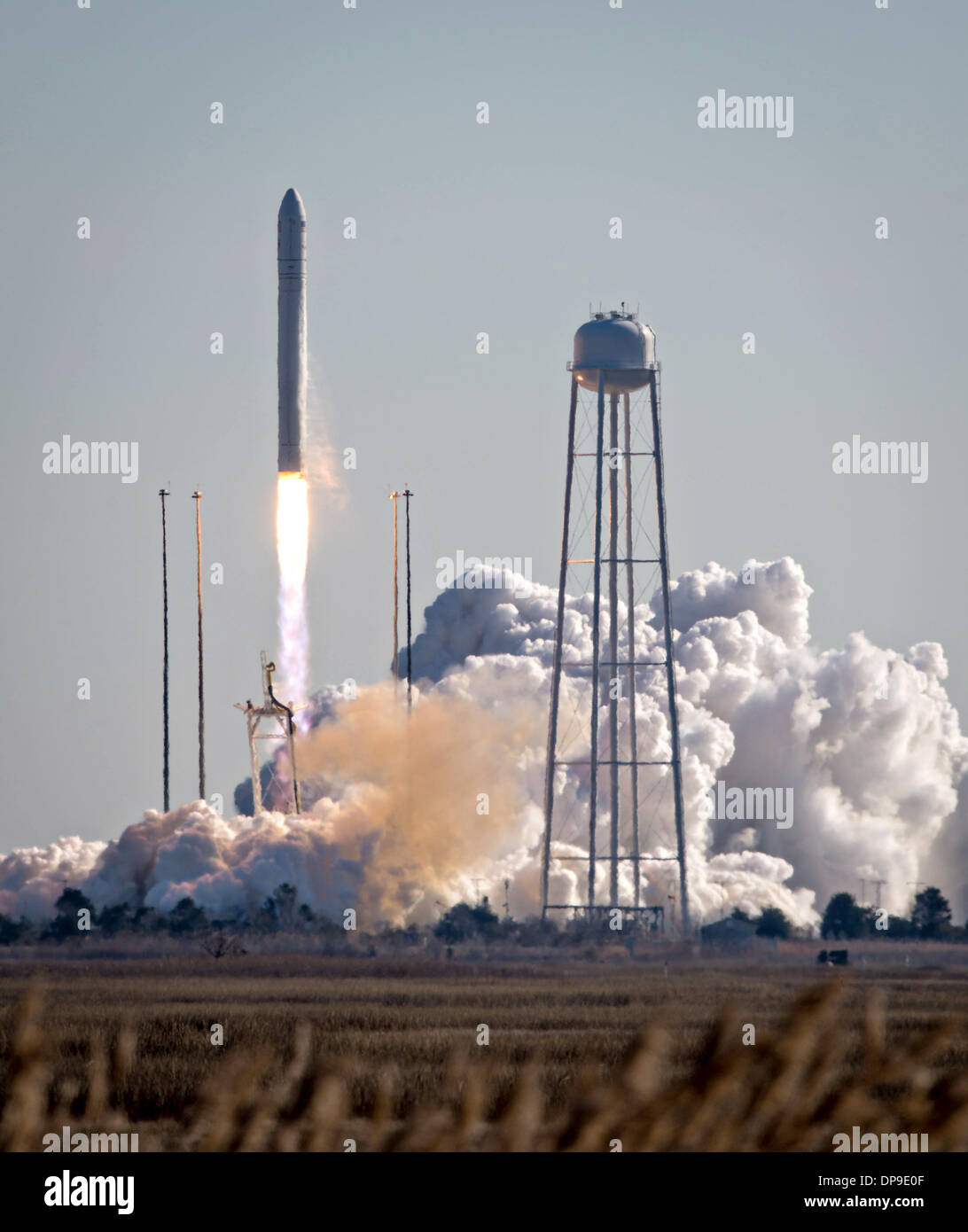 An Orbital Sciences Corporation Antares rocket launches from Pad-0A at NASA's Wallops Flight Facility January 9, 2014 in Wallops Island, VA. Antares is carrying the Cygnus spacecraft on a cargo resupply mission to the International Space Station. Stock Photo