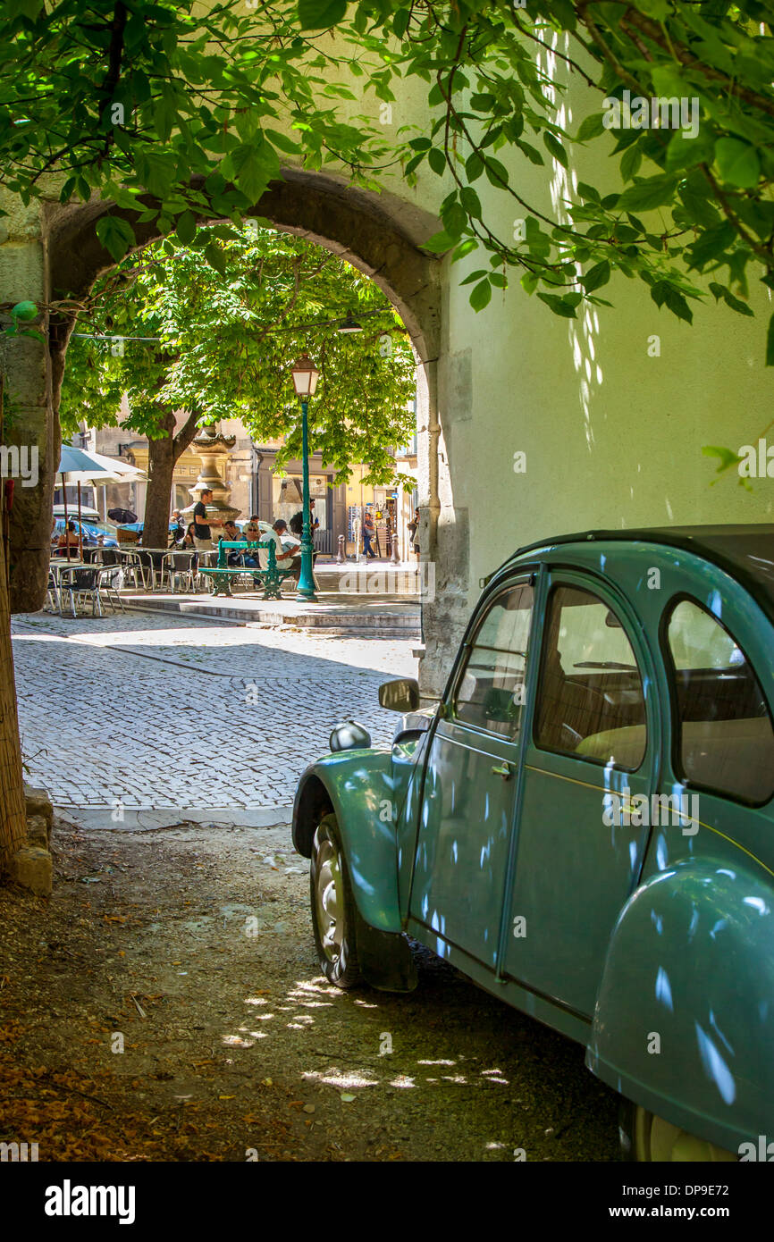 Les Deux Chevaux - old underpowered French car parked facing the public square - Place Favier, in Saint Remy de-Provence, France Stock Photo