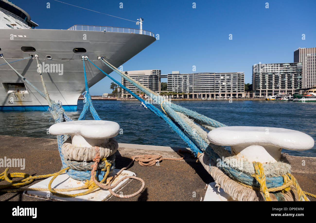 Prow of a cruise ship docked and tied to moorings in Sydney Harbor, New