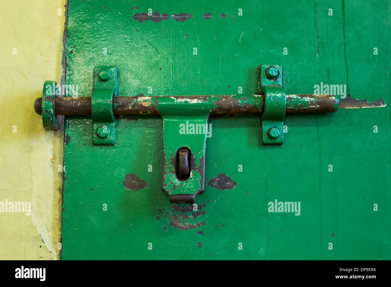 Close up of old worn green painted sliding bolt Stock Photo Alamy