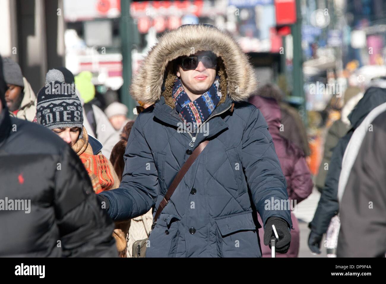 New York, YSA, USA. 7th Jan, 2014. A blast of record-breaking arctic air hit the United States on Tuesday, 7 January, 2014, causing at least 17 deaths and widespread transportation delays. All 50 U.S. states recorded temperatures below freezing. New York City's Central Park recorded its lowest temperature for 7 January, -15.5 degrees Celsius (4 degrees Fahrenheit) in 118 years. In photo, a man waits for a bus in New York City. Photo: Mati Milstein/NurPhoto Credit:  Mati Milstein/NurPhoto/ZUMAPRESS.com/Alamy Live News Stock Photo