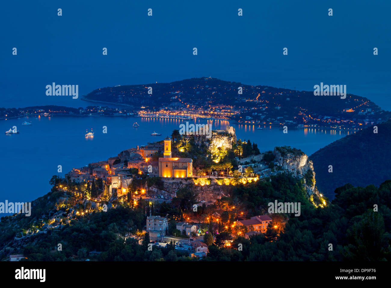 Twilight over the hilltop town of Eze with St. Jean-Cap Ferrat beyone, Provence France Stock Photo