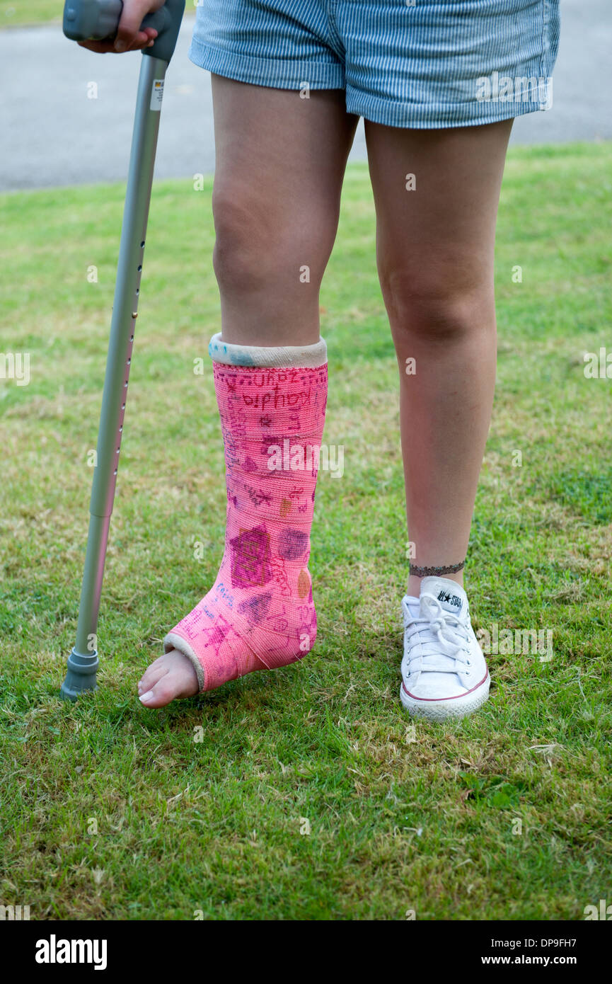 Teenage Girl on crutches Broken Leg Plaster Pink FULLY MODEL RELEASED