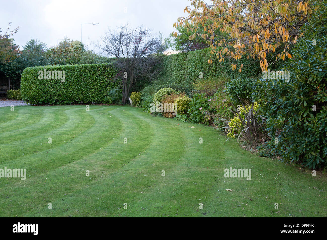 Curved front lawn grass garden large English country house Stock Photo