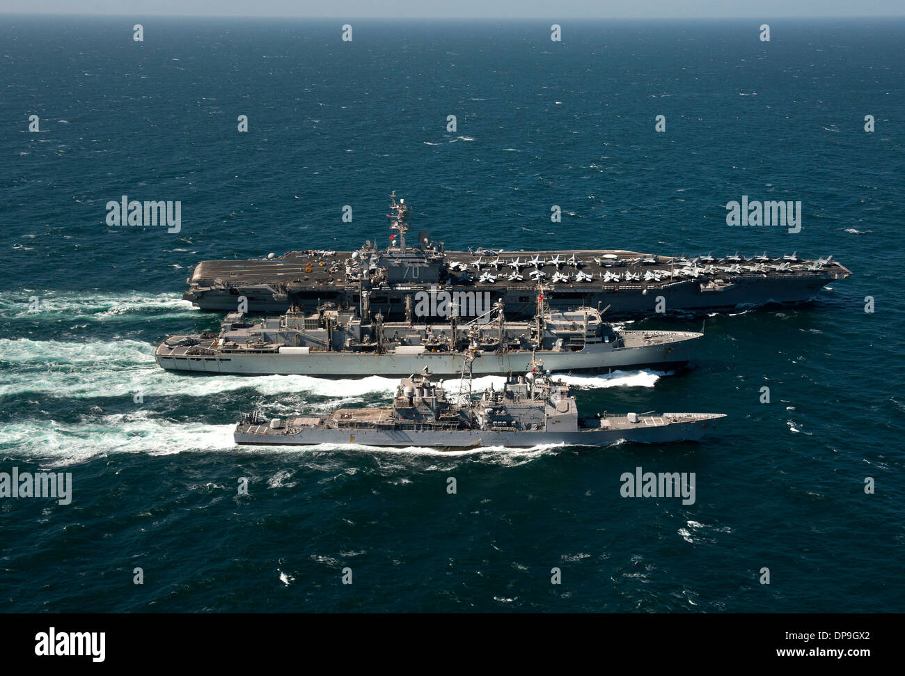 Aircraft carrier USS Carl Vinson, guided missile cruiser USS Bunker Hill and support ship USNS Bridge Stock Photo