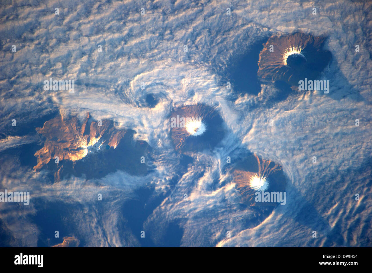 Islands of the Four Mountains of the Aleutian Island chain, Carlisle, Cleveland, Herbert, and Tana volcanoes. Stock Photo